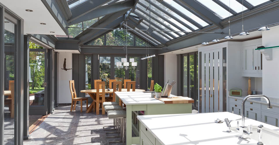 A modern airy kitchen extension provides a contrast with other rooms in ...