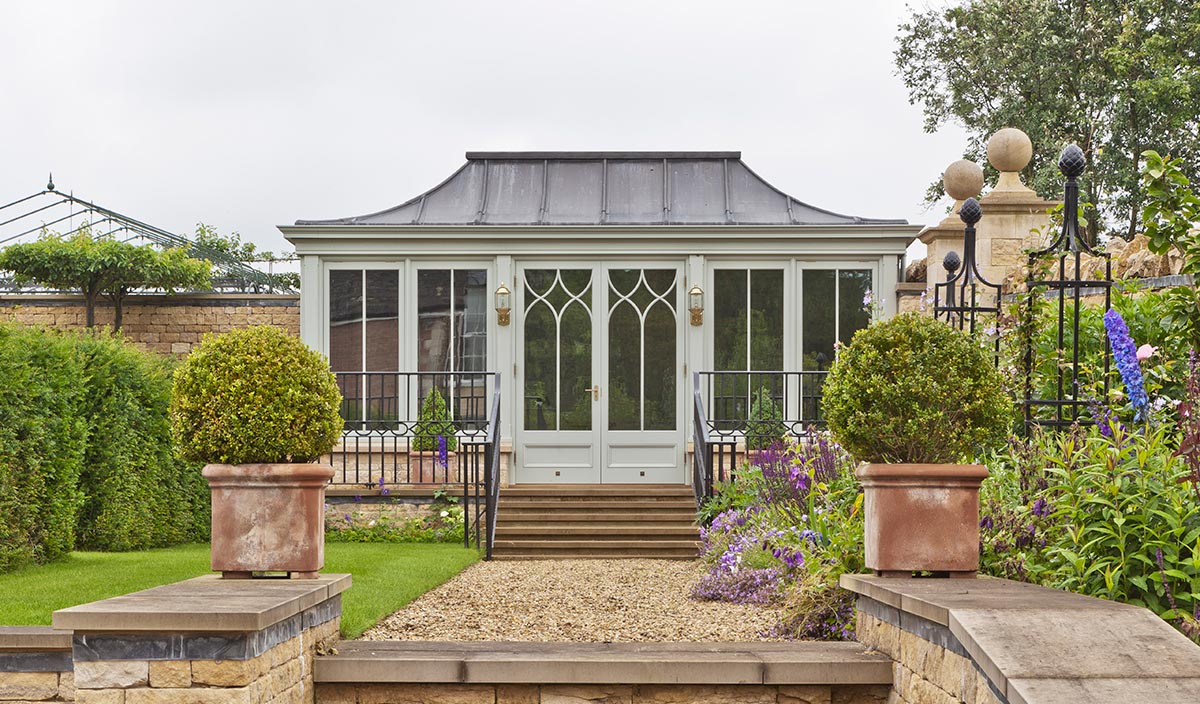 Freestanding conservatory with solid roof