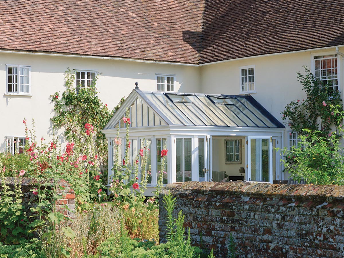 Glasshouse conservatory in a cottage garden